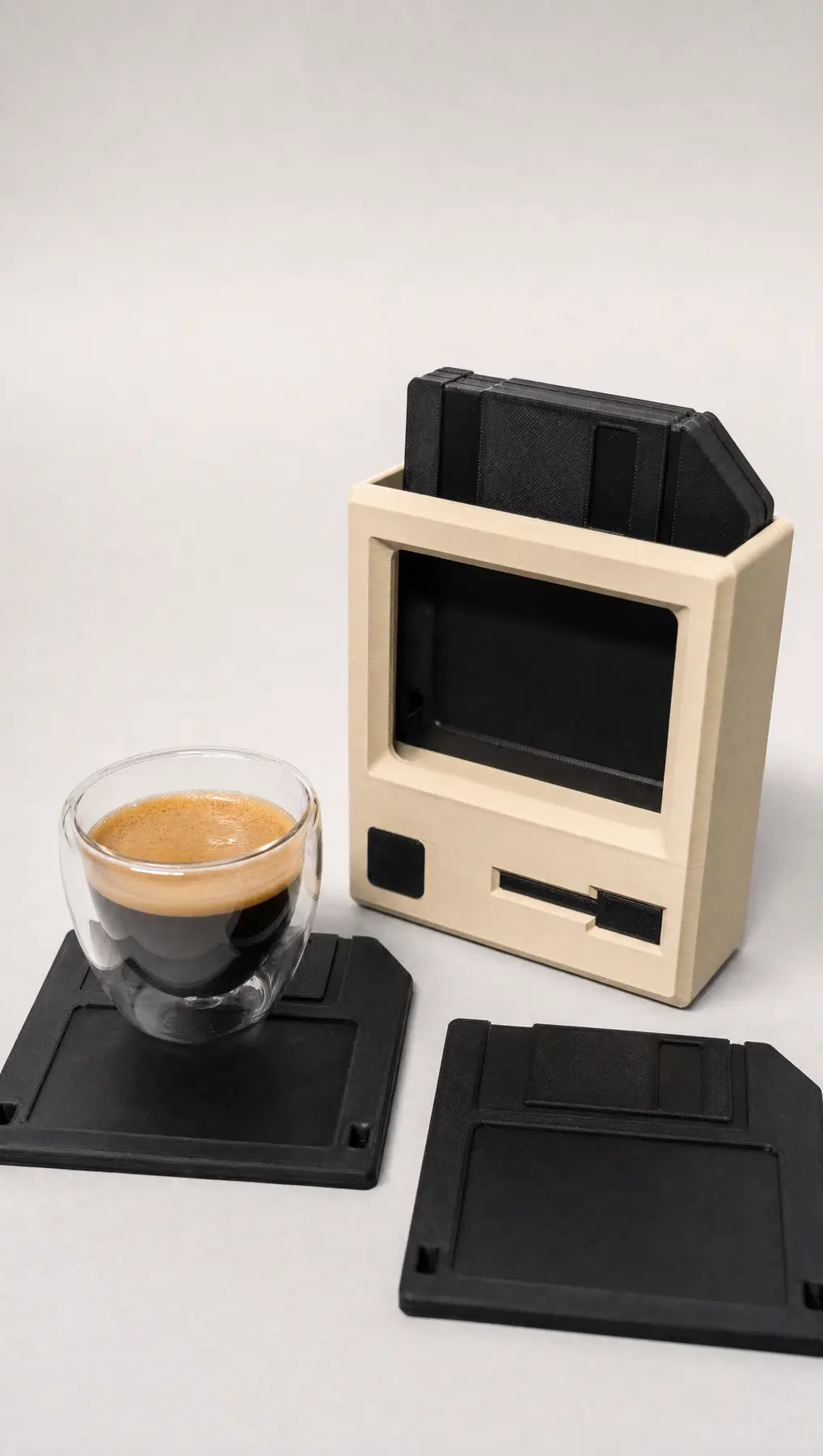 Coffee resting on a floppy disk coaster
