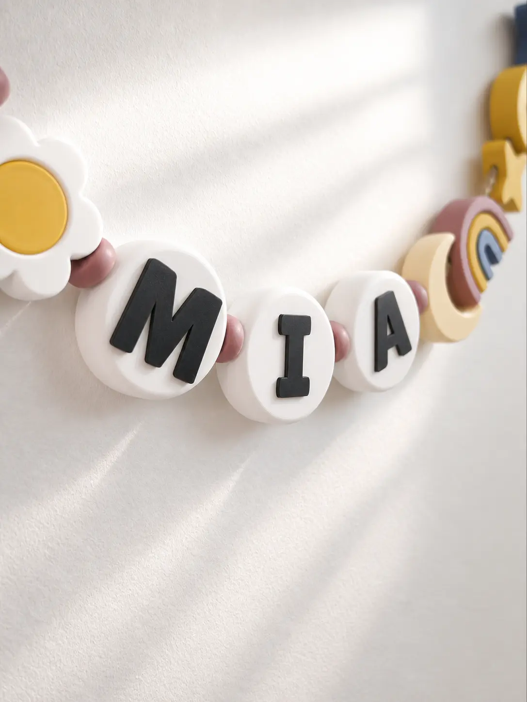 MIA name garland with colorful decorative beads