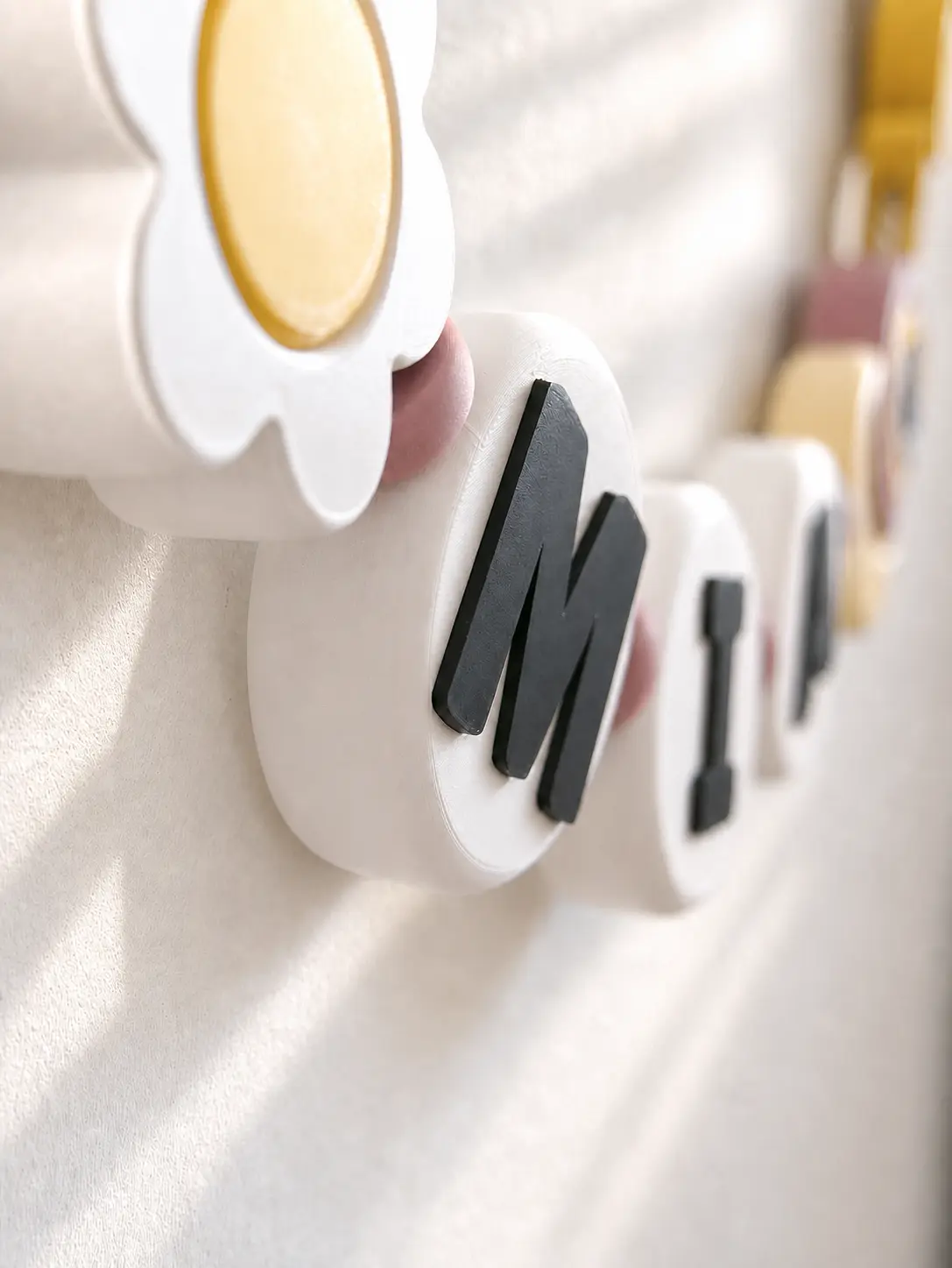 Close view of a MIA letter bead