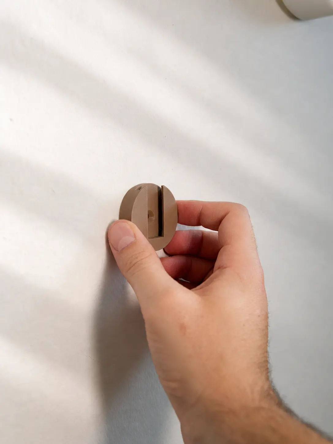 Two-part wall mount being fitted to the wall
