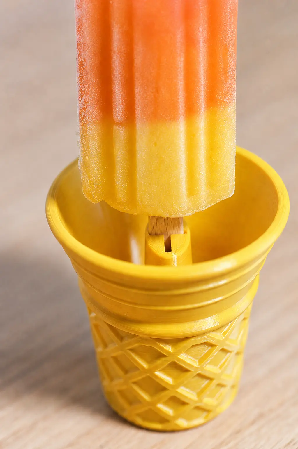 Printed Popsicle Drip-Catcher on a table
