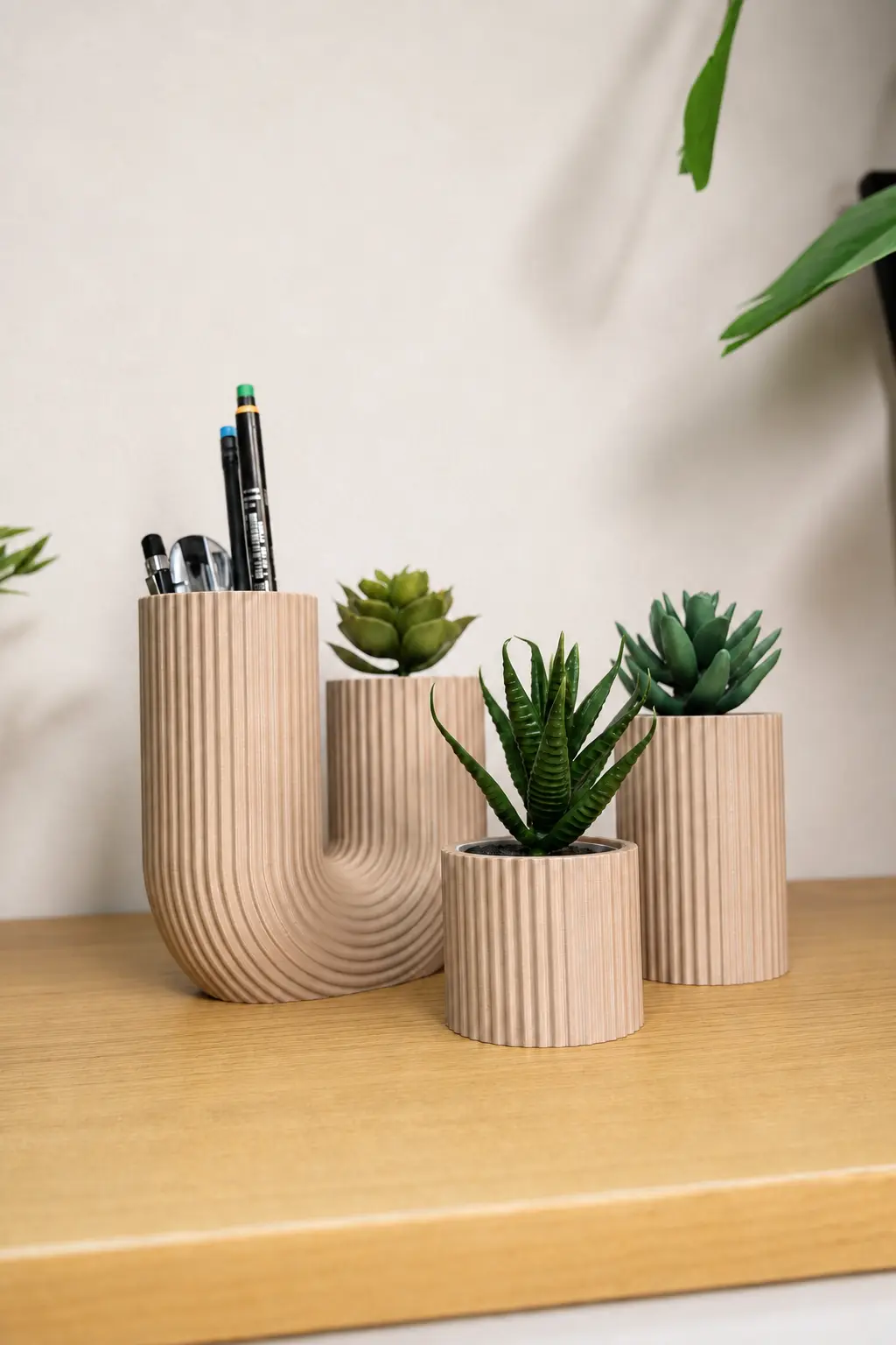 U-FORM displayed with matching ribbed planters