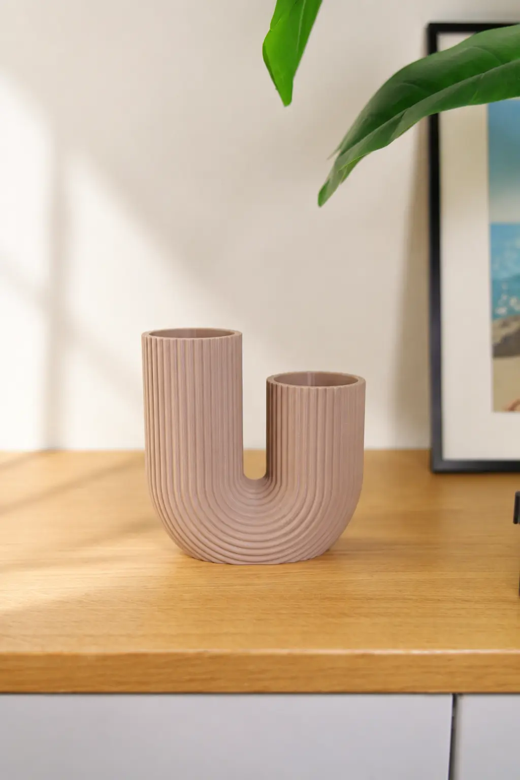 U-FORM printed in a soft pink finish