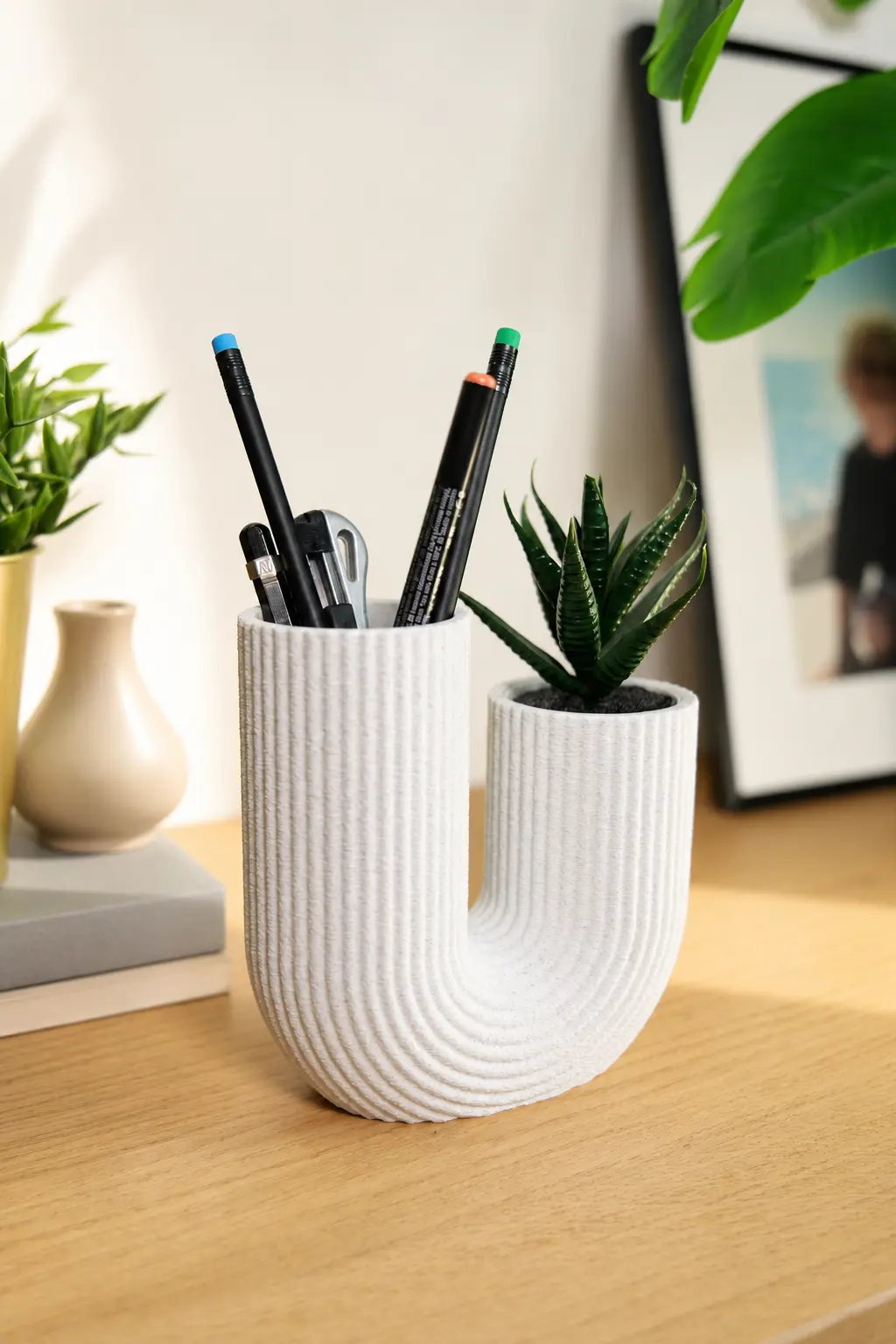 White U-FORM used as a pen holder and planter