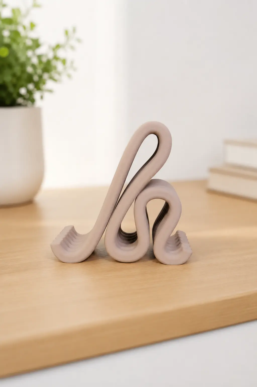 WAVE phone stand forms in a neutral finish